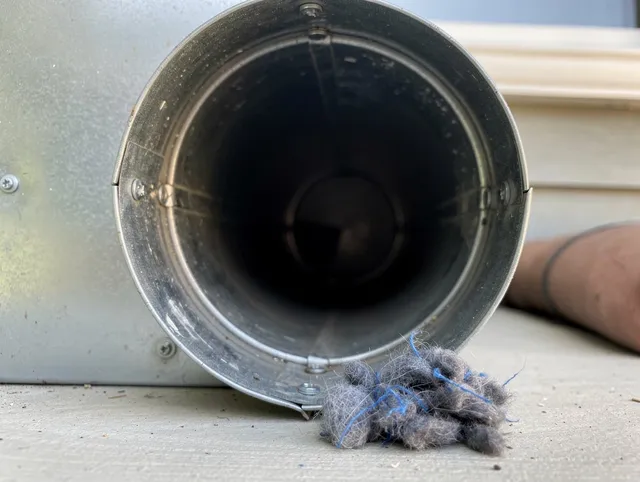 Stratford Dryer Vent Cleaning technician using specialized equipment to clear severe dryer vent blockage in Stratford